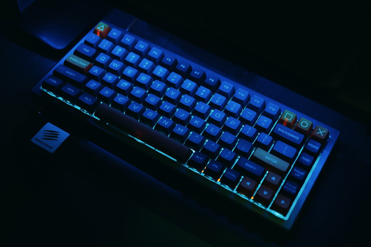 our-services-1 A close-up view of an illuminated mechanical gaming keyboard with RGB lighting.